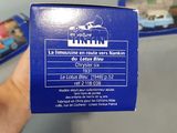 a person holding a blue box with a train on it