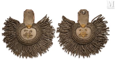 two pairs of silver and gold earrings with fringes on them