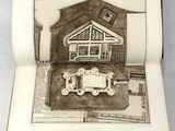 un livre ouvert sur lequel est dessiné une maison
