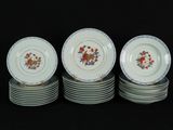 six plates with floral designs are stacked on top of each other