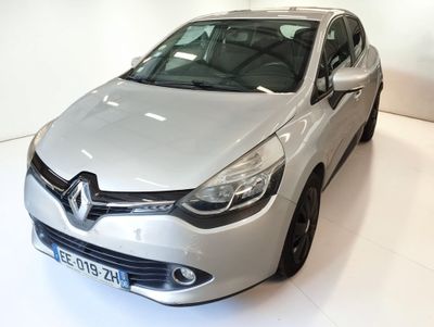 a silver car that is parked in a showroom