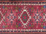 an oriental rug with a red and blue design on a white background