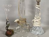 a glass table with a candle and a glass plate on it