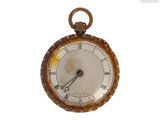 an old pocket watch with a chain around it