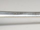 a close up of a spoon with a handle on it