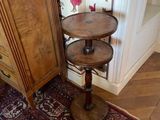 a small table with a shelf on top of it