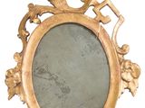 a gold frame with a mirror on it on a white background