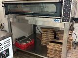 a large oven that is sitting on top of a table