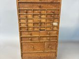 an old wooden chest of drawers with many drawers and drawers