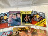 several magazine covers on a bed with a woman in a car