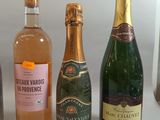 several bottles of wine are lined up on a table