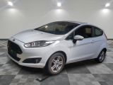 the white car is parked on a checkered floor in the garage