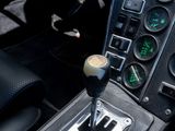 a close up of a car ' s dashboard with a shift button
