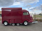a red truck that is parked in a parking lot