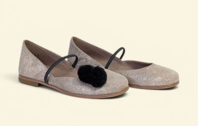 silver glitter ballerinas with black pom pom on the toe