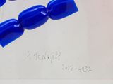 a drawing of a blue bead on a piece of paper