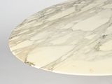 a marble table with a white base and a white base
