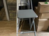 a stack of boxes and a chair in a room