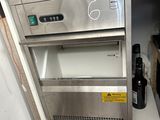 an image of a stainless steel refrigerator with a lot of toothpicks in it
