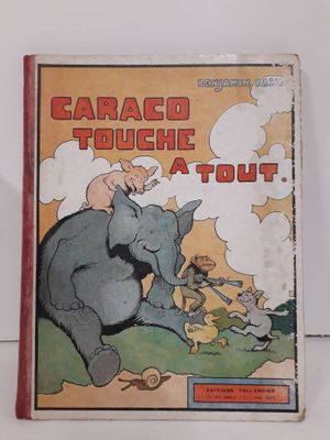un vieux livre pour enfants avec l'illustration d'un éléphant et d'un homme chevauchant cet éléphant