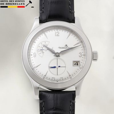 a watch with a white dial and black leather strap