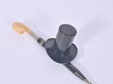 a black top hat with a wooden handle on a white surface