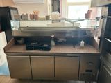 an image of a kitchen with stainless steel appliances and counter tops