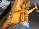 a yellow machine that is sitting on the ground