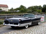 a black and white car parked on the side of the road