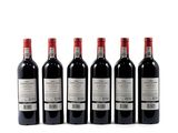 six bottles of red wine lined up on a white surface