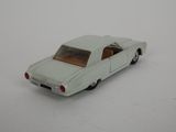 a toy car that is sitting on a white surface