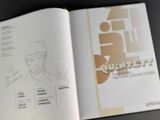 an open book with a drawing of a man in a hat