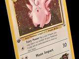 une carte Pokémon sur laquelle figure un Pokémon rose