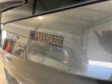 a close up of a car with a sticker on it