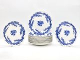 six blue and white plates stacked on top of each other