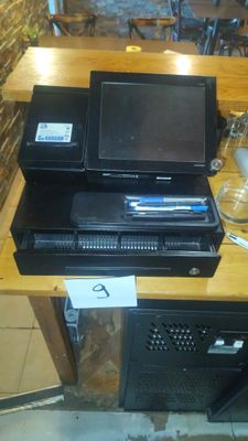 a laptop computer sitting on top of a wooden desk