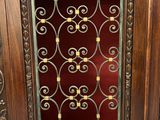 a wooden cabinet with a glass door in it