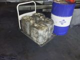 a cart full of gas cans and a blue and white bucket