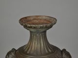 a vase that is sitting on a table in a room