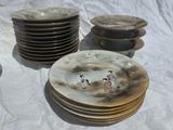 a lot of plates that are sitting on a table