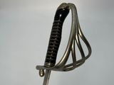 a close up of a sword with a metal handle on a white background