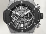 the watch is black and silver with a black strap around it