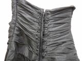 a close up of a corset with a corset on it