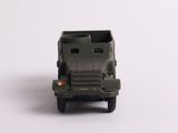 a toy army vehicle that is sitting on a white surface