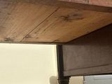a wooden table with a drawer underneath it