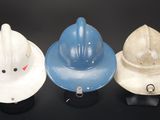three hats that are sitting next to each other on a table