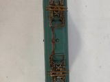 a green toy train on a white surface
