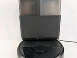 an image of a robotic vacuum cleaner sitting on top of a table