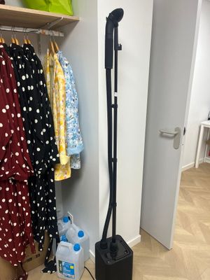 a vacuum that is sitting on the floor in a room
