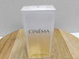 a close up of a box of perfume on a wooden table